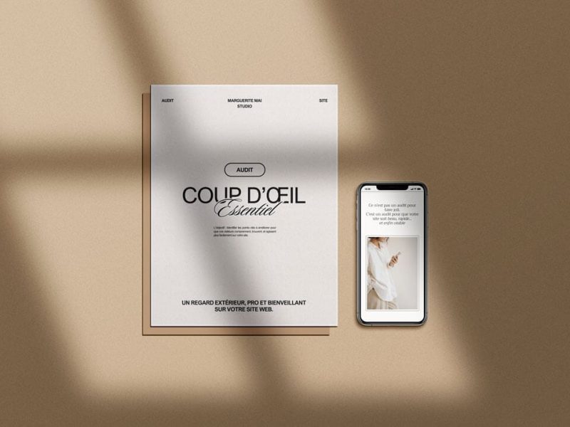 Rapport d'audit "Coup d'œil Essentiel" posé sur un bureau à côté d'un smartphone.